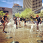 Playing in the fountain in Patriots Square: 