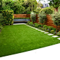Photo of a medium sized classic back garden in London with a living wall and natural stone paving.