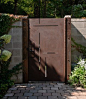 Custom made corten steel entry gate is laser cut to mimic the inlays in the walnut entry door. Phot: Aaron Leitz: 