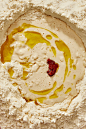 This may contain: a bowl filled with white and yellow food