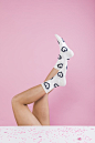 Premium Photo | Legs in white socks with heart pattern