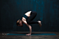 Young sporty woman doing hand standing yoga pose by Pavel Biryukov on 500px