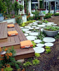 Backyard deck ideas - round stepping stones with grasses and moss growing between the stones.: 